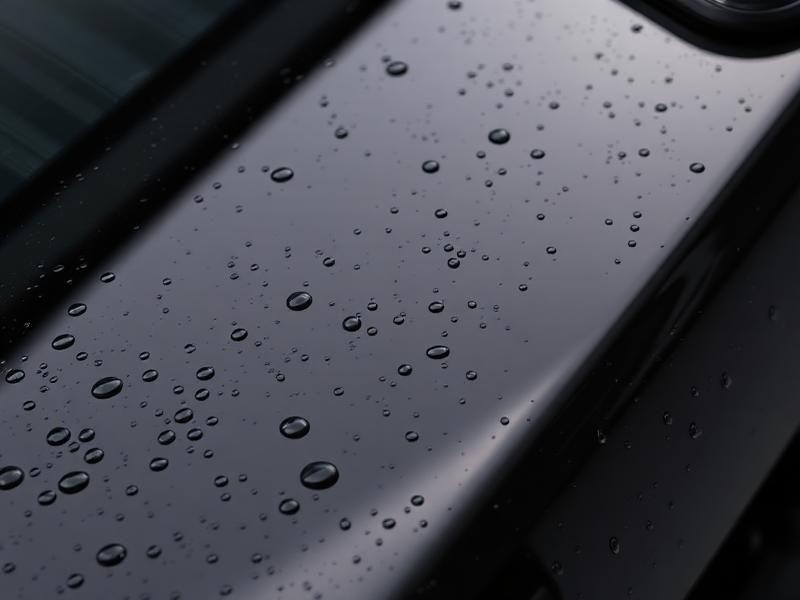 Glossy black paint finish with water beading